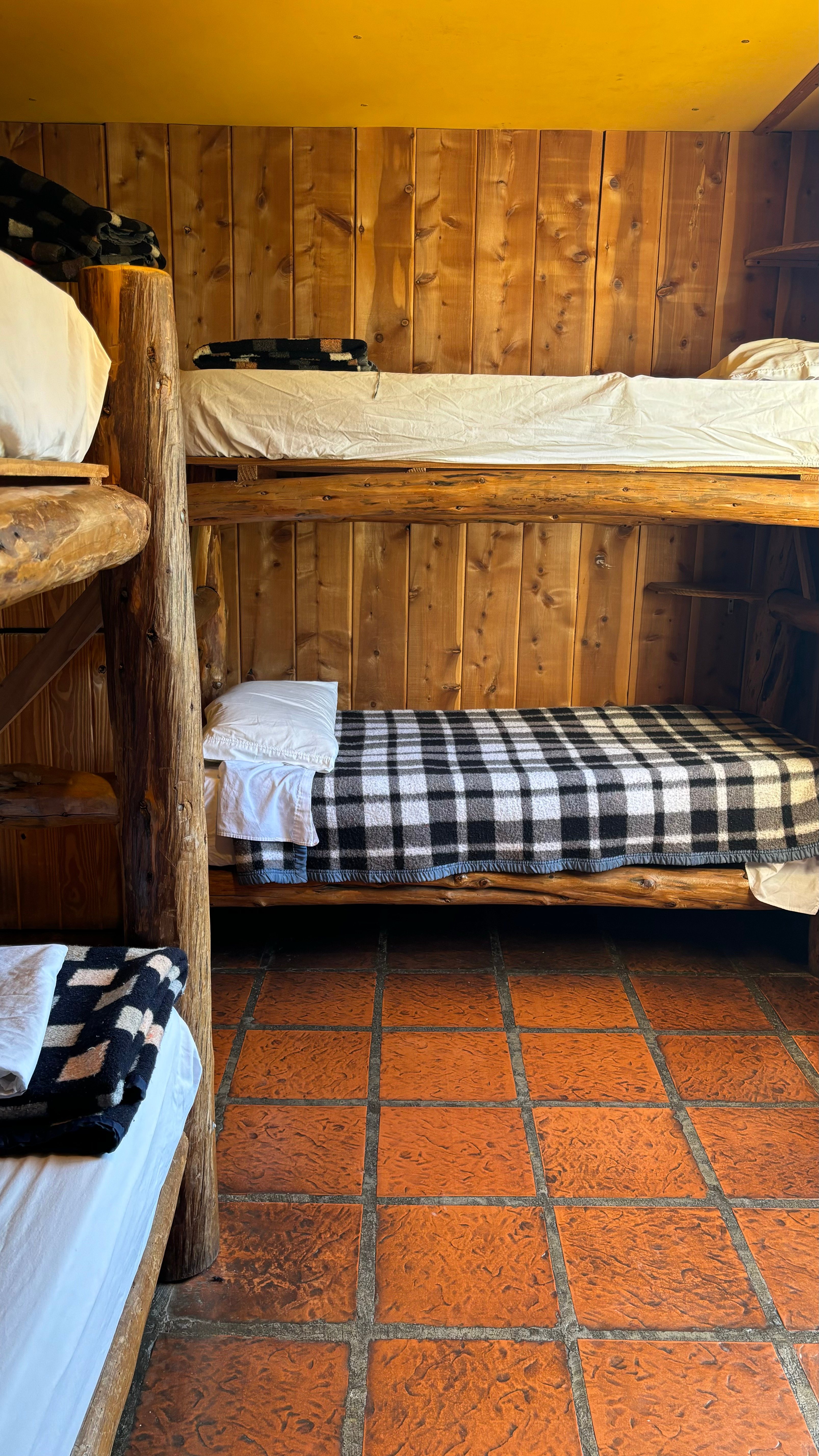 Dorm room with comfortable bunk beds and warm lighting