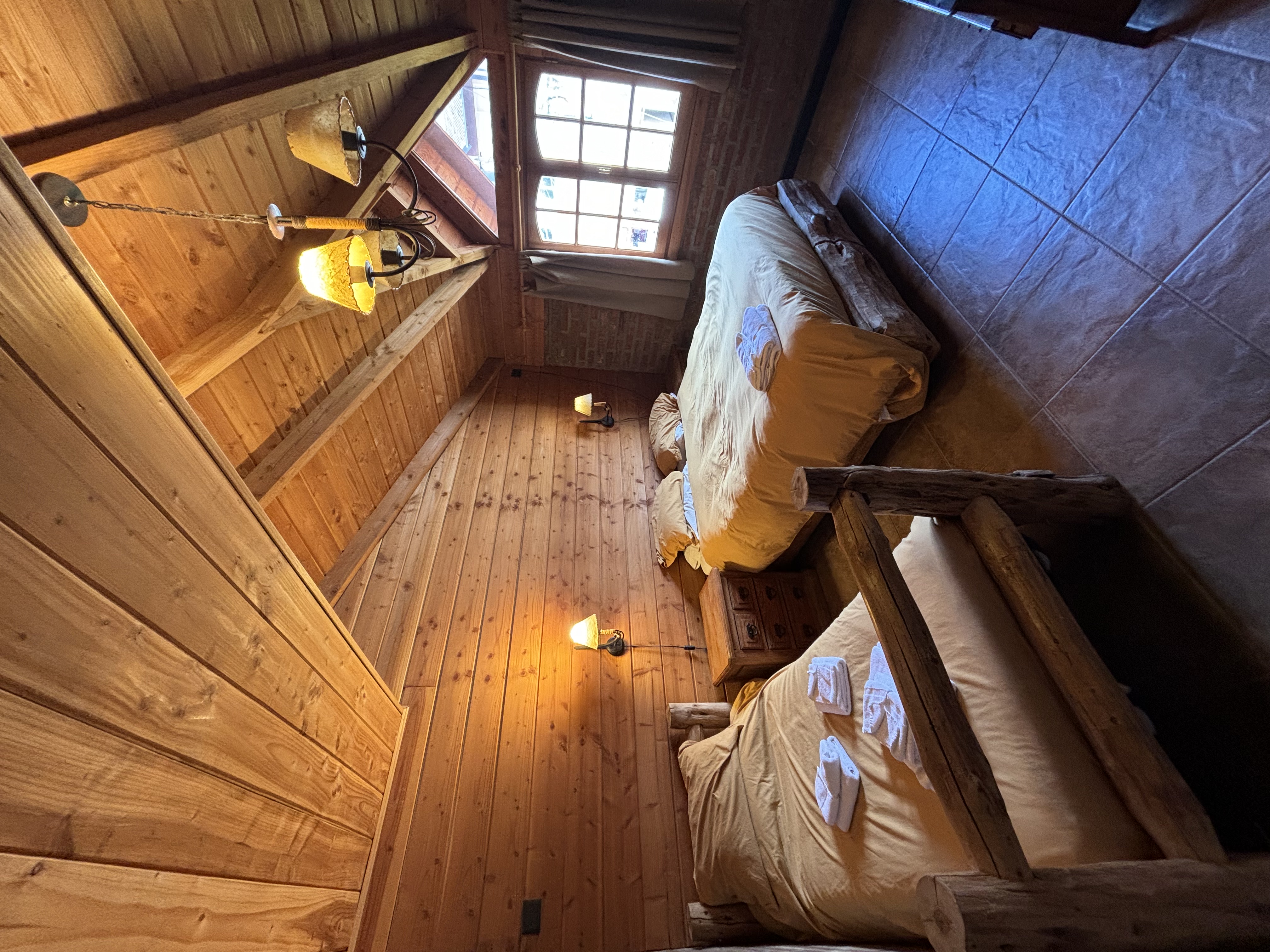 Spacious private room with vaulted ceiling and window